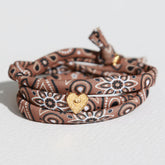 Brown bandana-style bracelet with gold heart