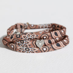 Brown bandana-style bracelet with silver heart