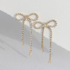 Boucles d'oreilles en or avec strass en forme de nœuds