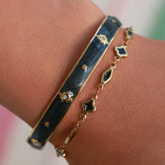 Gold bangle stars black