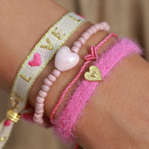 Conjunto de pulseras rosas