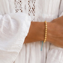 Armband gouden kraal blauw