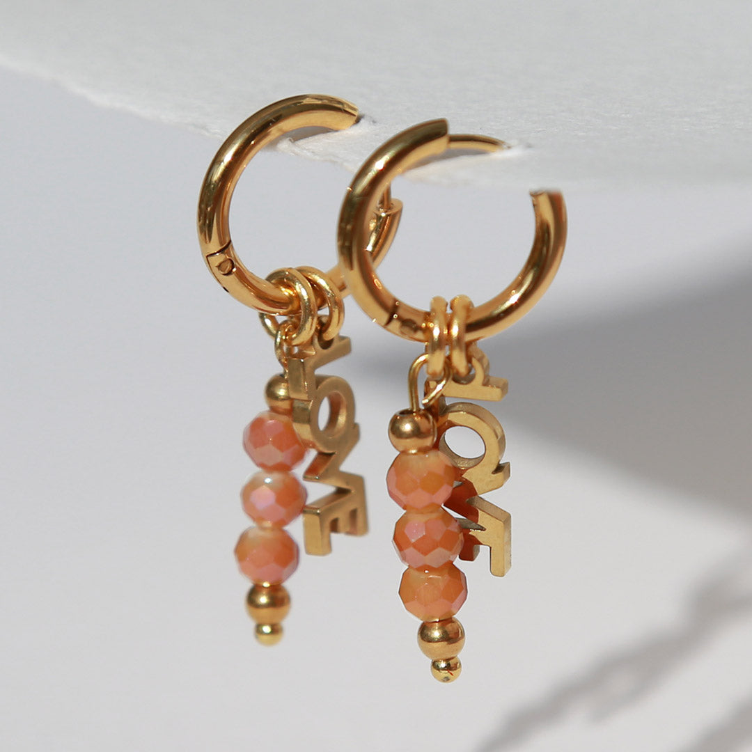 Boucles d'oreilles en or facettes orange