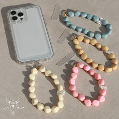 Telefonschmuck Schleife Perle Creme